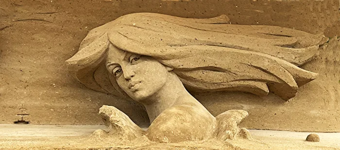 All made of sand... (Mermaid stretches her head out of the water)