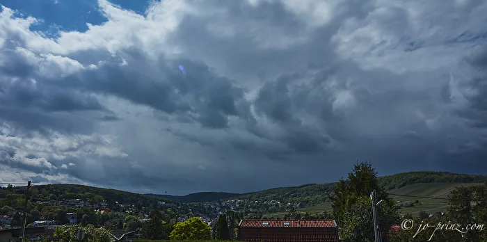 the wind drives rain across the land