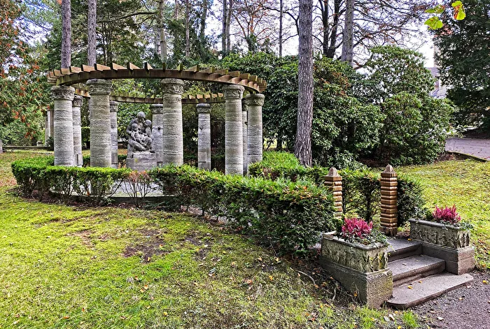 Rotunda-shaped, column-lined, and covered with a pergola burial site