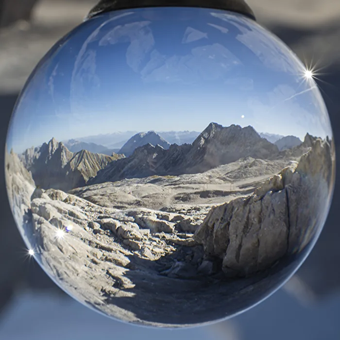 Summit and slope in a glass ball
