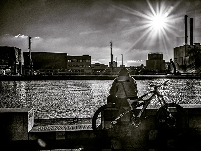 The sun, the water, and his bicycle